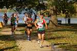 Andrew running through the picturesque park beside the lake