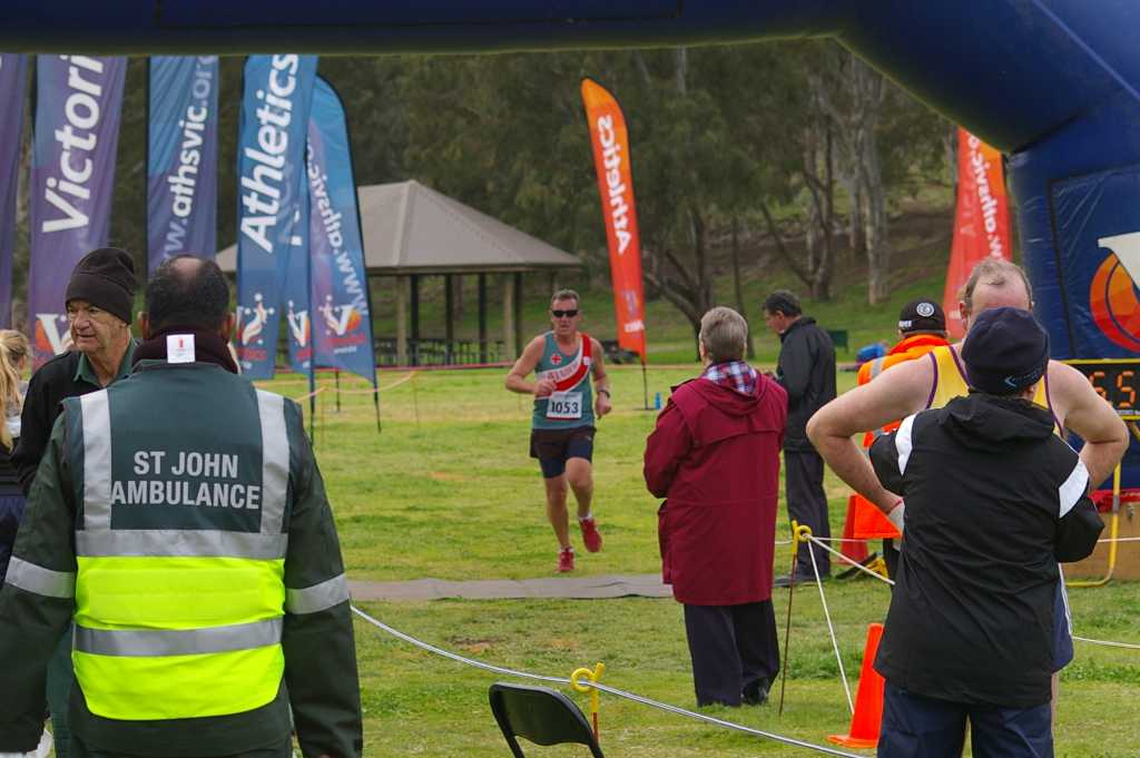 John crossing the finish line