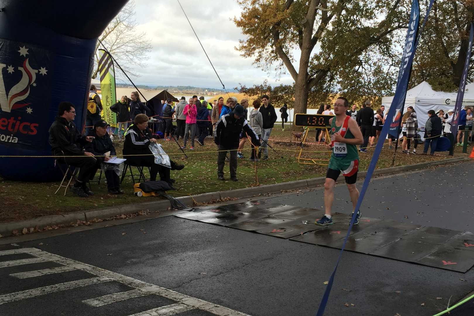 Chris crossing the finish line