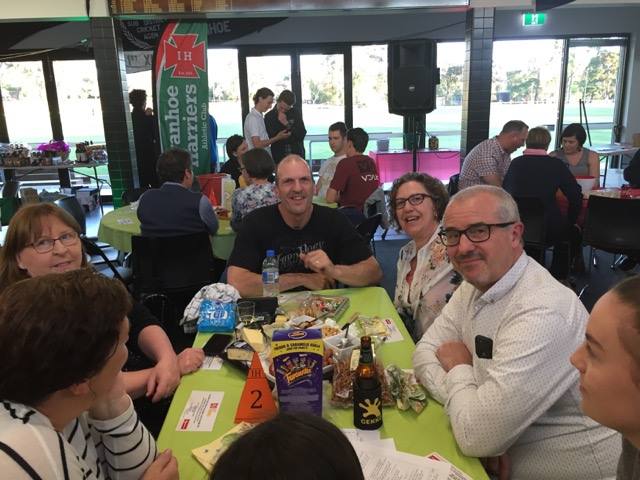 A table of contestants enjoying the Triva Night